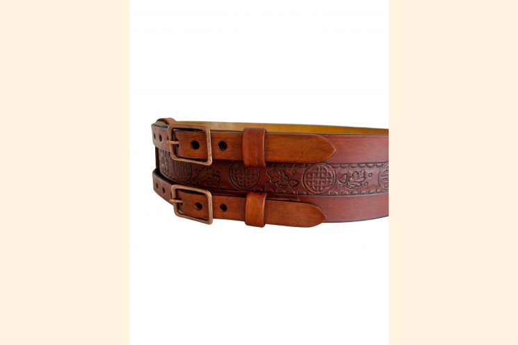 Right front view of brown leather double buckle belt with Celtic knot, detail