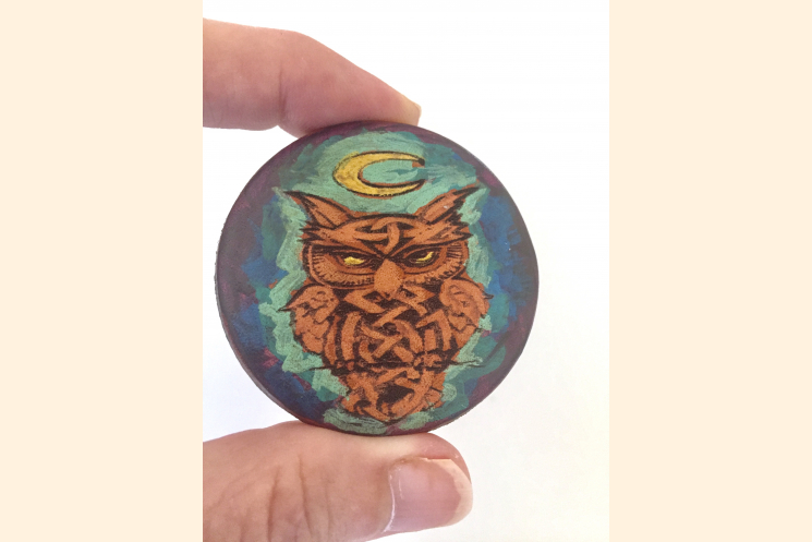 Celtic Owl Magnet with Blue and Purple Held with Thumb and Forefinger for Scale