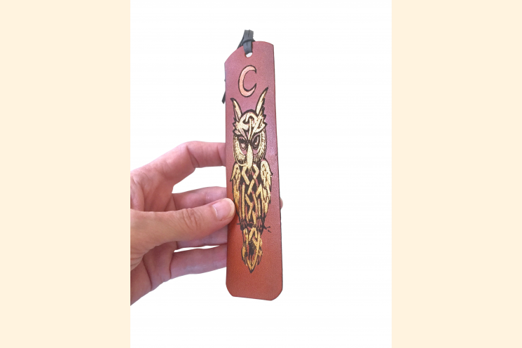 Celtic Owl Bookmark Held With Hand to Show Scale