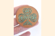 Celtic Shamrock Magnet Held on Three Fingers for Scale Close Up
