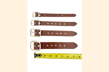 Four sizes of buckle straps next to ruler to see strap length